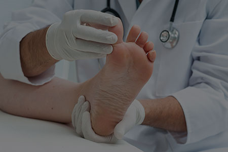 Foot Doctor Examining Big Toe